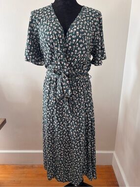 One Loved Babe world travellers dress green floral